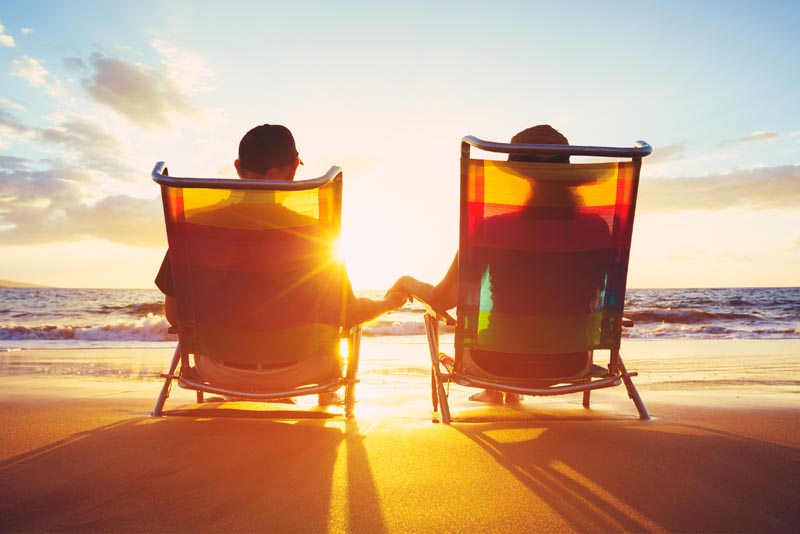 Image of a woman covered in coloured powder at a festival.